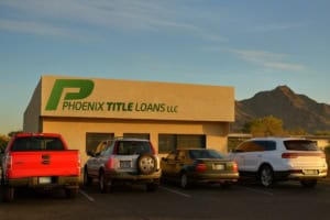 Fast cash title loan store in Phoenix with outdoor parking and mountain view.